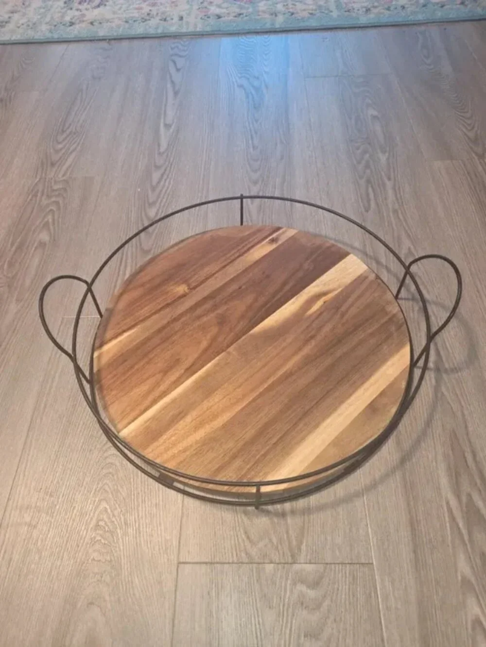 Acacia wood serving tray with black metal wire rim and handles, 16 inch diameter